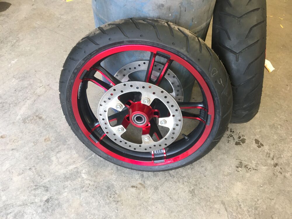 Red custom-painted motorcycle wheel
